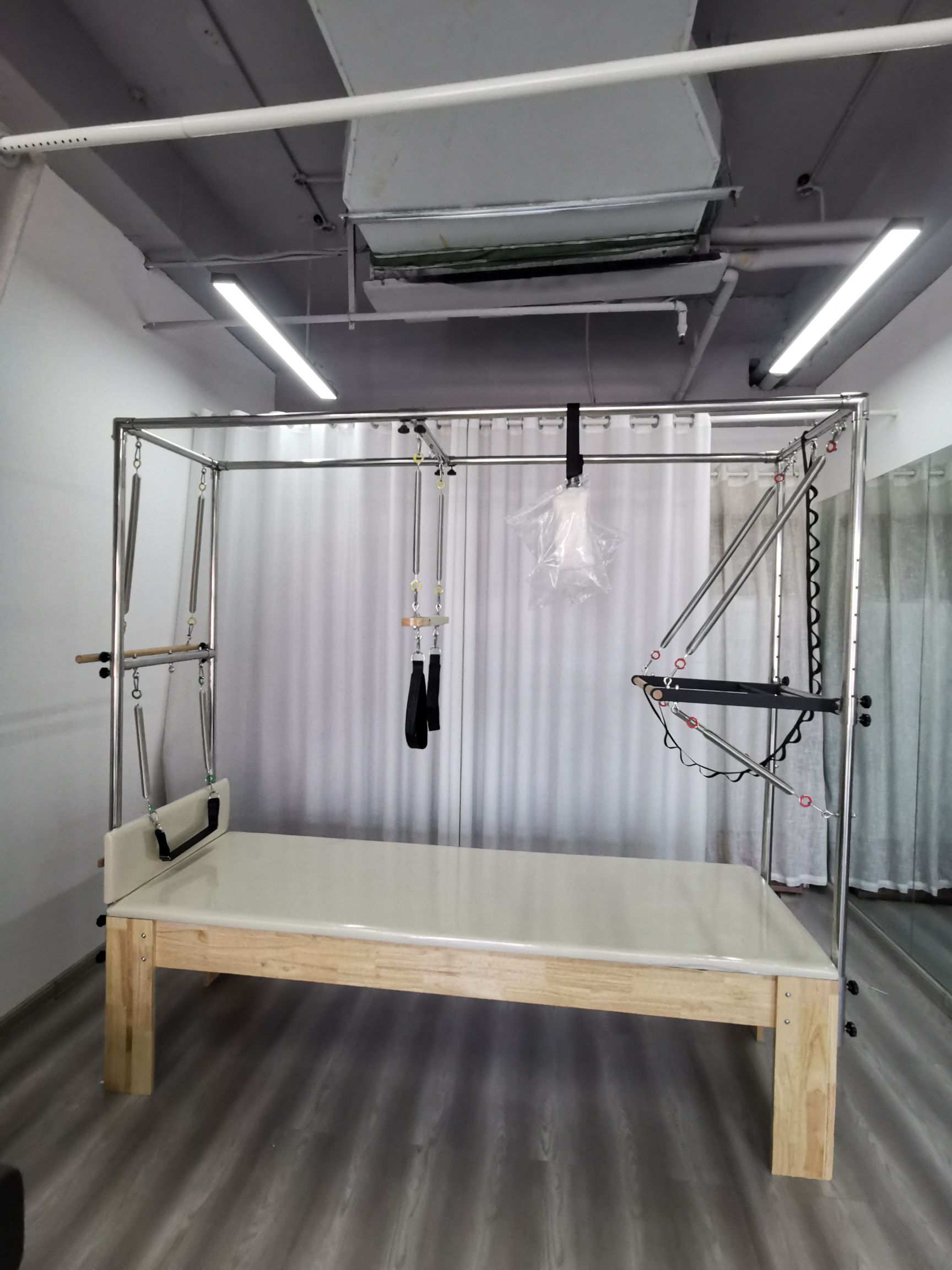 What Is the Difference Between a Reformer and a Cadillac Pilates Machine?